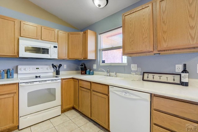 kitchen featuring lofted ceiling, light tile patterned flooring, white appliances, light countertops, and a sink
