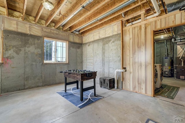 basement with washing machine and dryer and gas water heater