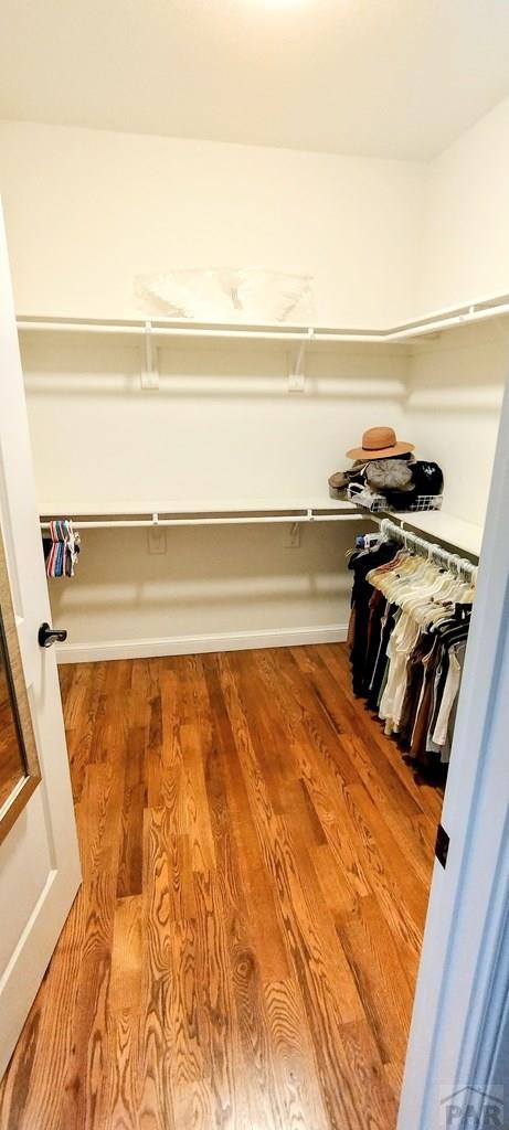 1470 Villa Spanada, Pueblo, CO 81006 - spacious closet featuring wood finished floors
