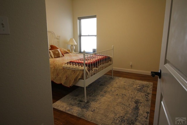 1470 Villa Spanada, Pueblo, CO 81006 - bedroom featuring wood finished floors and baseboards
