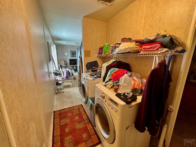 laundry area featuring laundry area and washer and clothes dryer