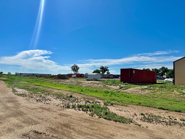 view of yard with a rural view