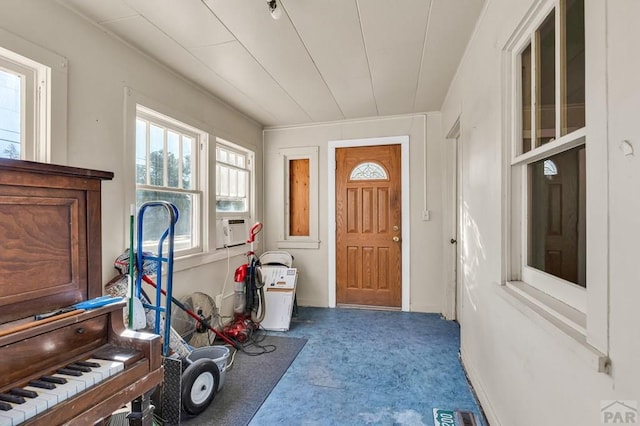 entryway featuring carpet floors and visible vents