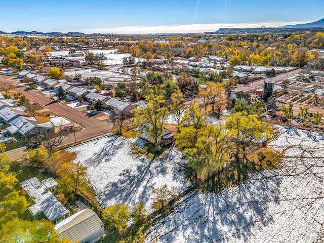 snowy aerial view featuring a residential view