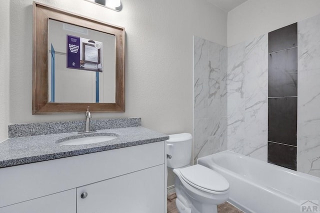 280 W Harmony Dr, Pueblo West, CO 81007 - full bathroom with a textured wall, bathtub / shower combination, toilet, and vanity