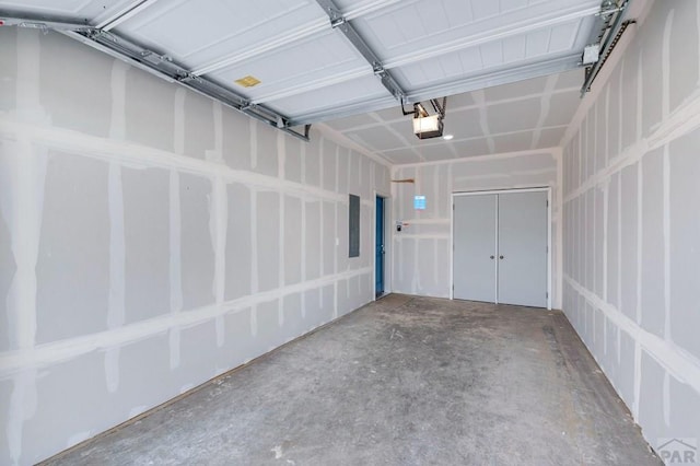 280 W Harmony Dr, Pueblo West, CO 81007 - garage featuring a garage door opener and electric panel