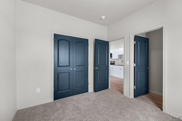 280 W Harmony Dr, Pueblo West, CO 81007 - unfurnished bedroom featuring baseboards, a closet, and carpet floors