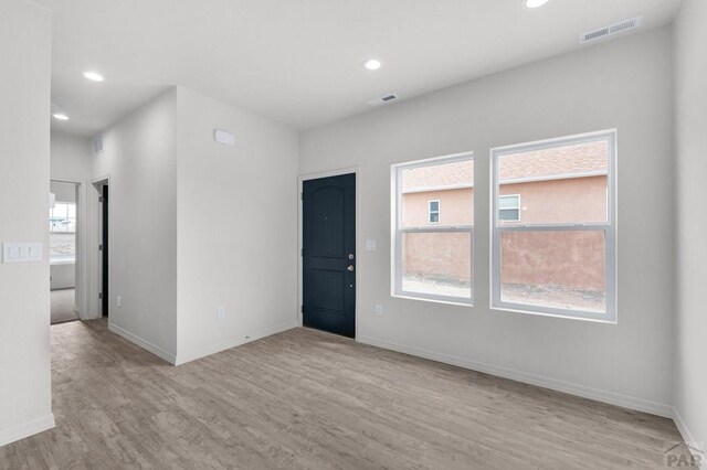280 W Harmony Dr, Pueblo West, CO 81007 - empty room with visible vents, light wood-style flooring, and recessed lighting