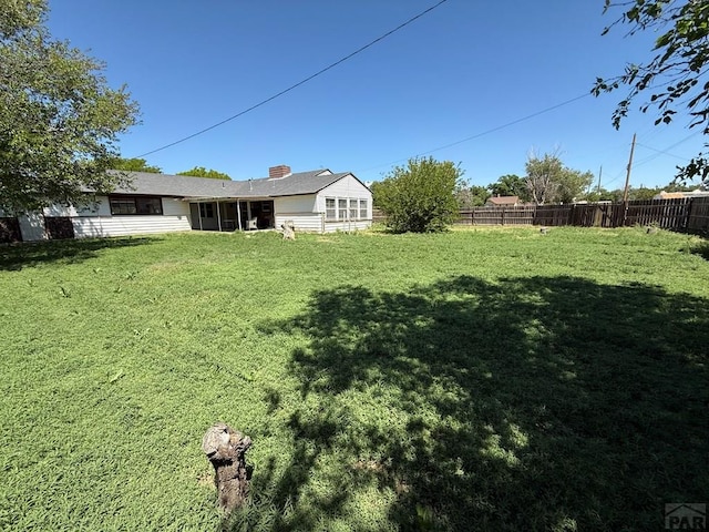 480 W 9th Ave, Lamar, CO 81073 - view of yard with a sunroom