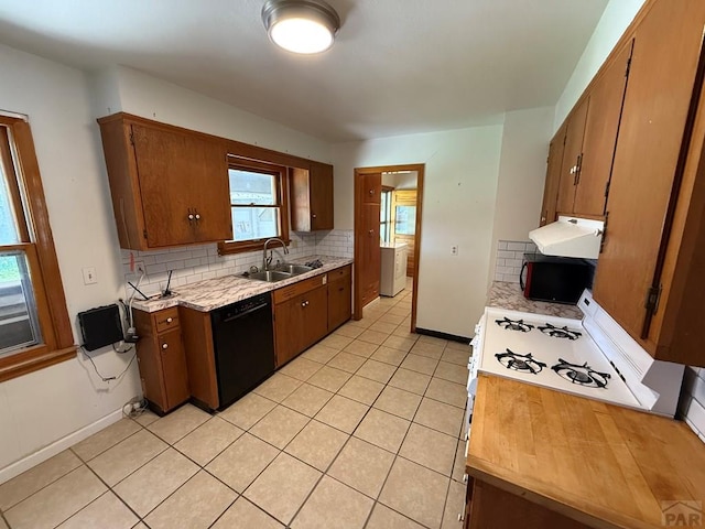 480 W 9th Ave, Lamar, CO 81073 - kitchen featuring black appliances, a sink, light countertops, extractor fan, and tasteful backsplash