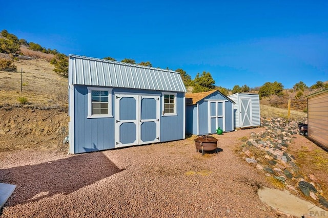 1918 Kelly Creek Trl, Canon City, CO 81212 - view of shed featuring an outdoor fire pit