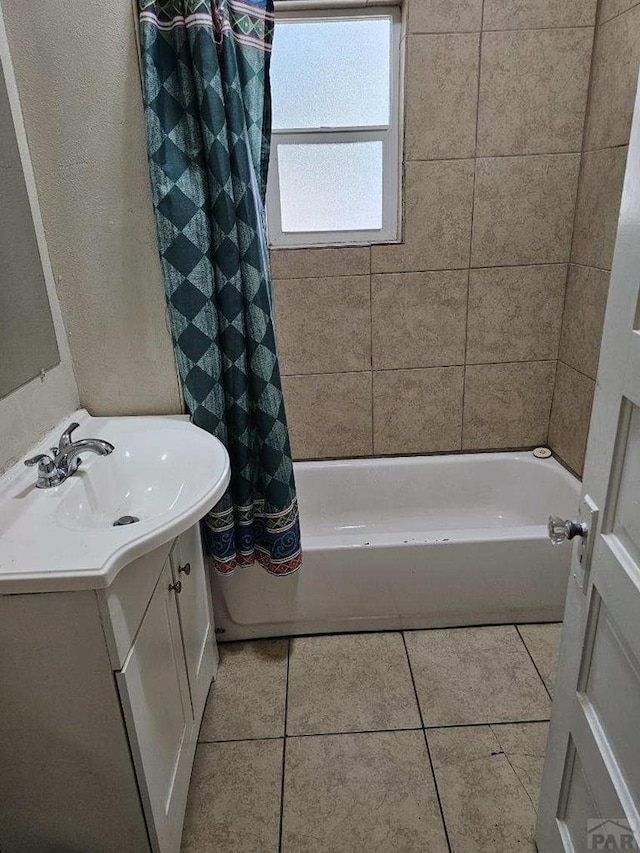 bathroom with vanity, shower / tub combo with curtain, and tile patterned floors