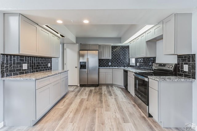 862 S Los Mochis Way, Pueblo, CO 81007 - kitchen with stainless steel appliances, tasteful backsplash, light wood-style flooring, light stone counters, and recessed lighting