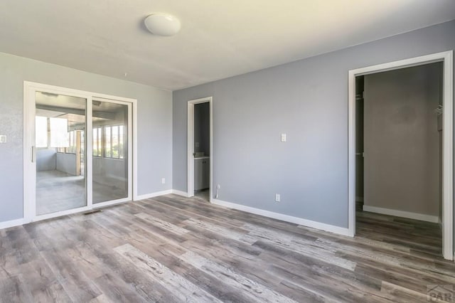 862 S Los Mochis Way, Pueblo, CO 81007 - empty room featuring wood finished floors and baseboards