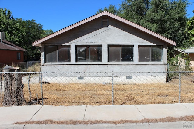 view of property exterior featuring crawl space and fence