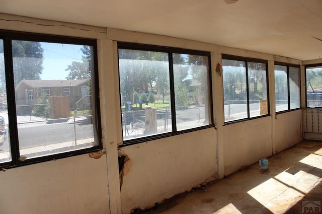 unfurnished sunroom with a healthy amount of sunlight