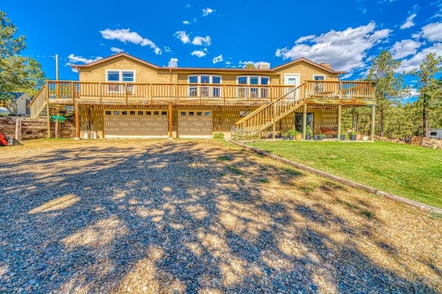 view of front facade featuring a deck, gravel driveway, stairway, and a front lawn