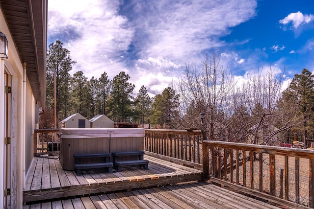 wooden terrace with a hot tub