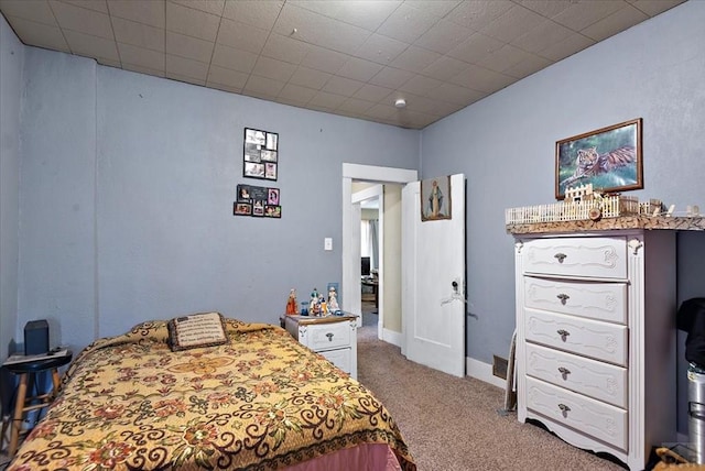 bedroom with carpet floors and baseboards