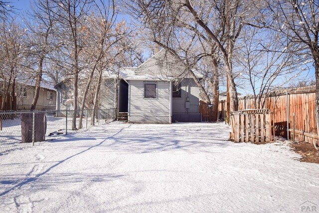 exterior space featuring entry steps and fence