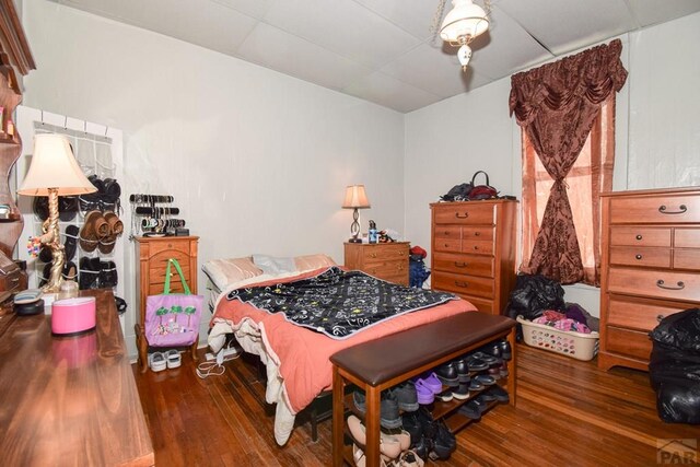 bedroom with dark wood finished floors