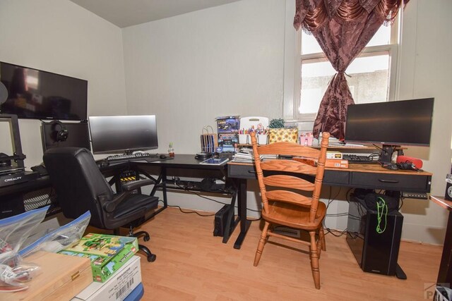 home office featuring light wood-style floors