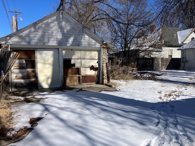 exterior space with an outbuilding and fence