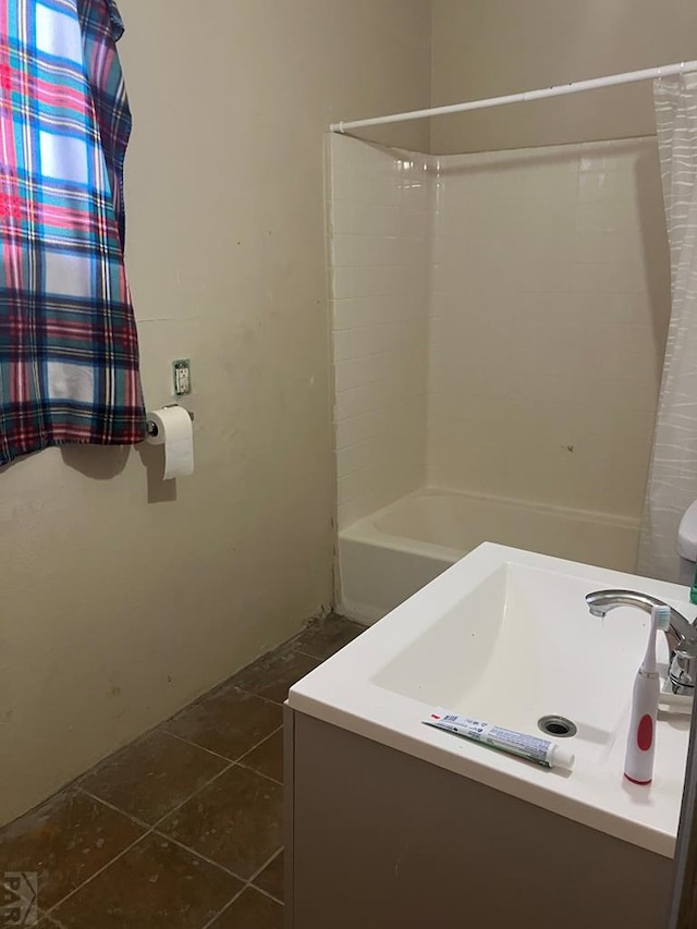 full bathroom with shower / bath combo with shower curtain and tile patterned floors