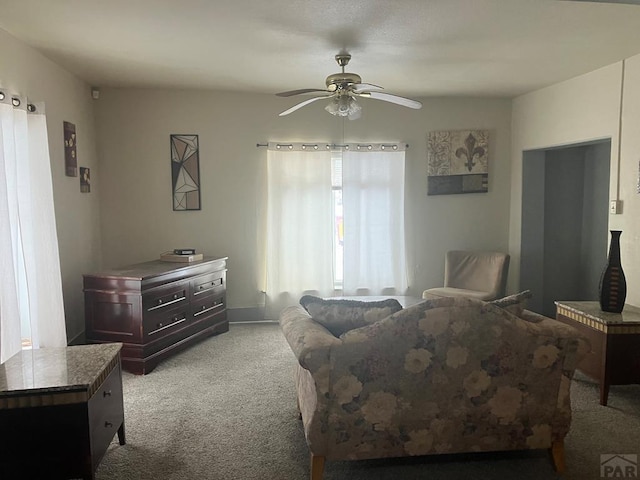 bedroom with light carpet and a ceiling fan