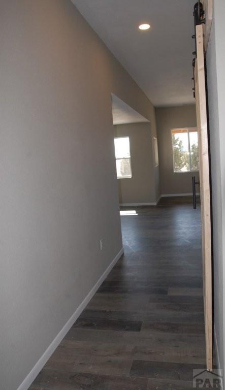 empty room featuring recessed lighting, light carpet, ceiling fan, and baseboards