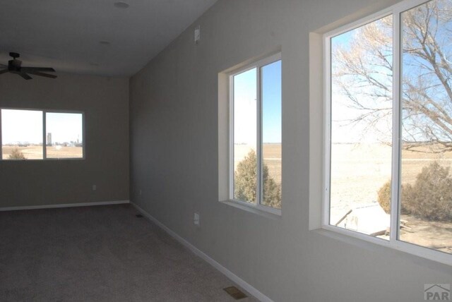 empty room featuring carpet floors, baseboards, a textured ceiling, and recessed lighting