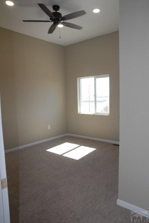 doorway with dark wood-type flooring, plenty of natural light, and baseboards