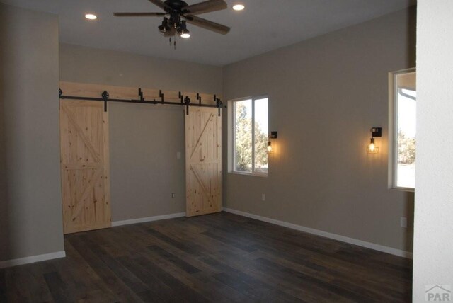 bathroom with wood finished floors, toilet, and baseboards