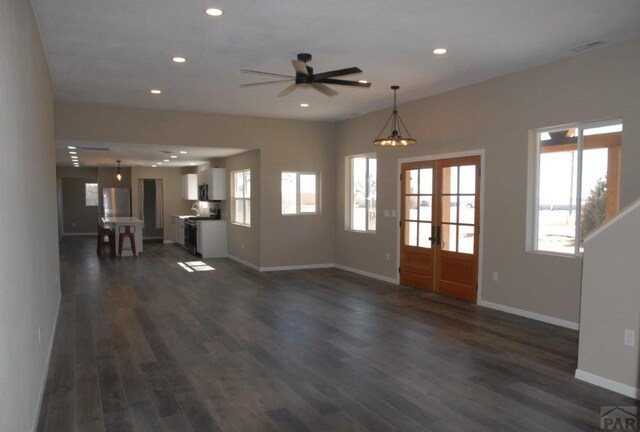 kitchen with stainless steel appliances, light countertops, and white cabinets