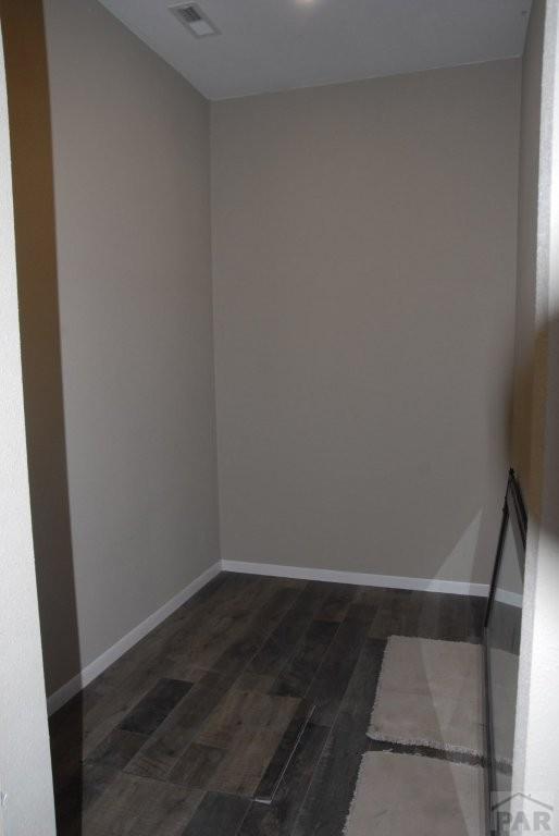 hallway with baseboards, carpet, and recessed lighting