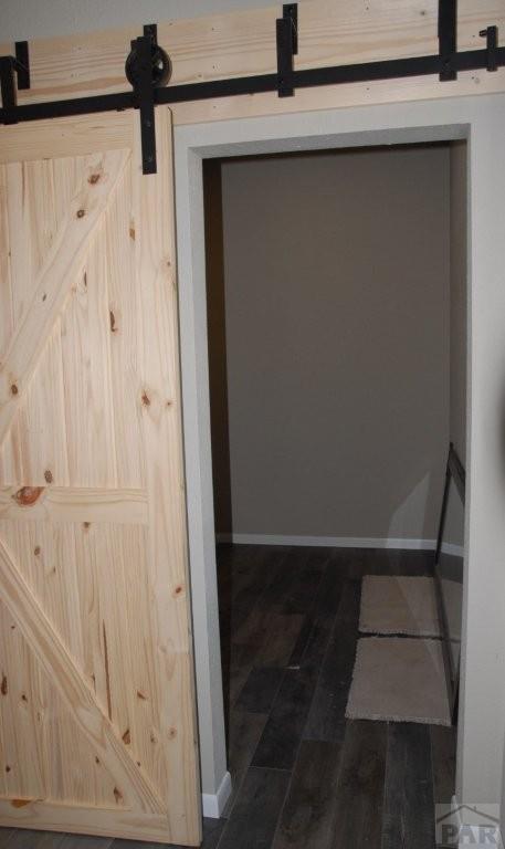 empty room featuring light carpet, baseboards, and recessed lighting