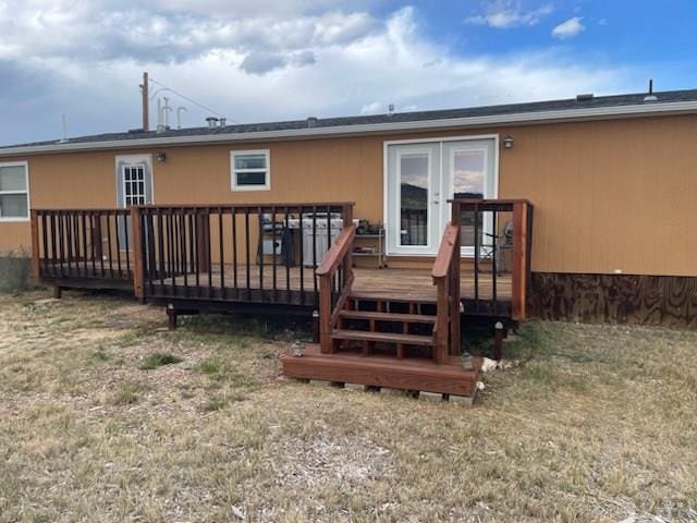 8417 3r Rd, Beulah, CO 80123 - back of property with french doors and a wooden deck