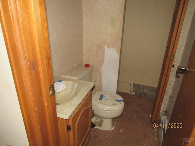 half bath with vanity and toilet