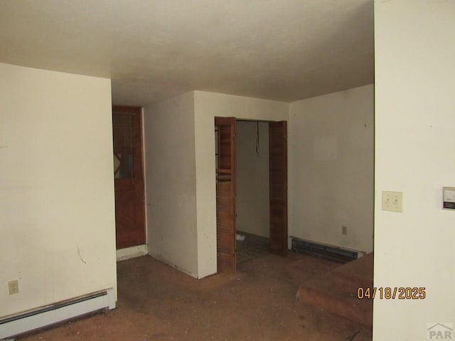 spare room featuring a baseboard radiator and baseboard heating