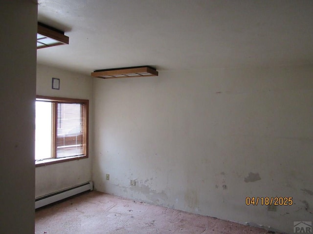 empty room featuring a baseboard radiator