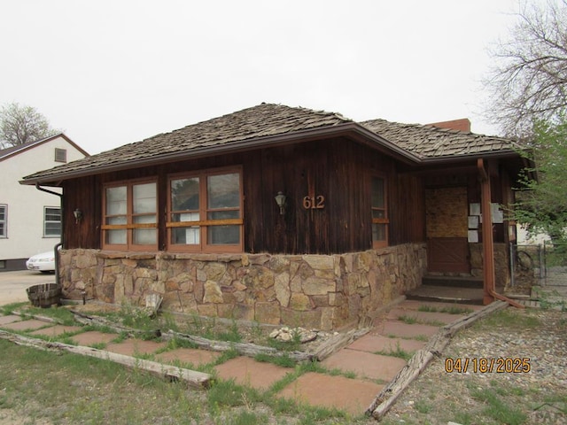 view of home's exterior with stone siding