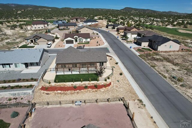 aerial view with a mountain view and a residential view