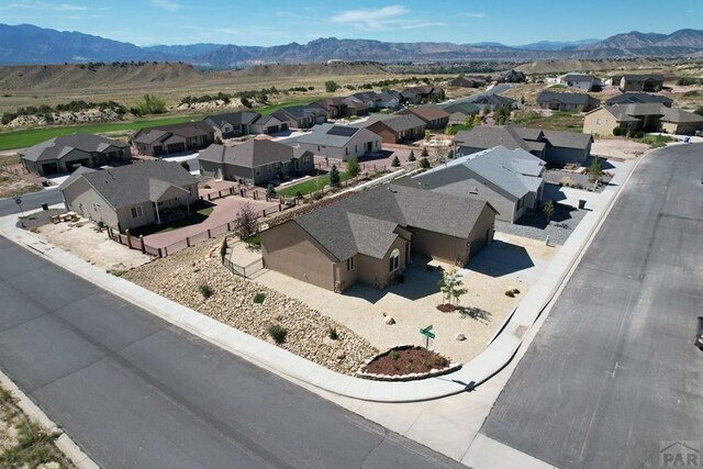 drone / aerial view with a residential view and a mountain view