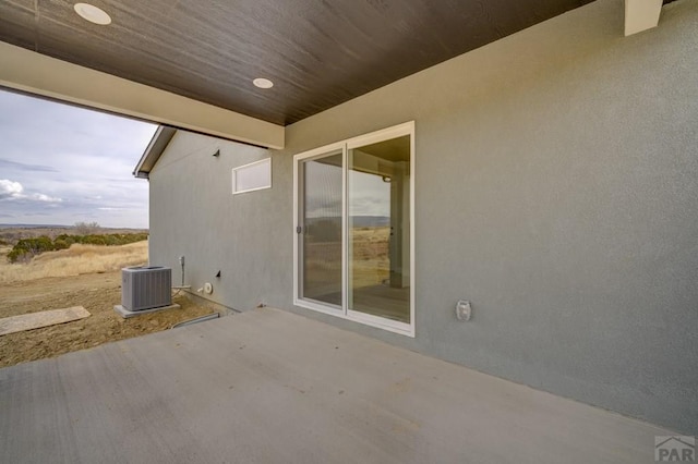 view of patio with central AC