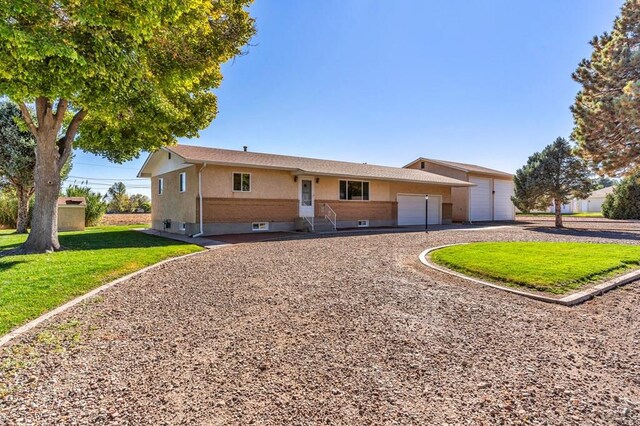 1510 24 1/4 Ln, Pueblo, CO 81006 - single story home with a front lawn, driveway, and entry steps
