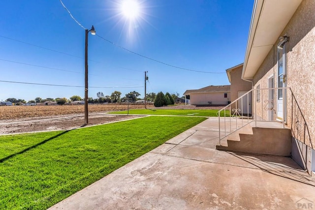 1510 24 1/4 Ln, Pueblo, CO 81006 - view of green lawn with a patio