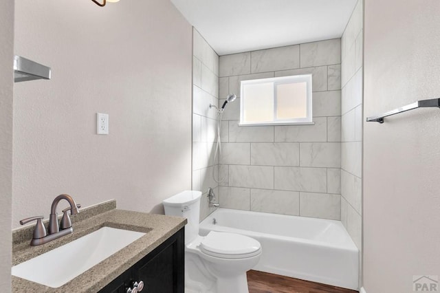 1510 24 1/4 Ln, Pueblo, CO 81006 - bathroom with toilet,  shower combination, wood finished floors, and vanity