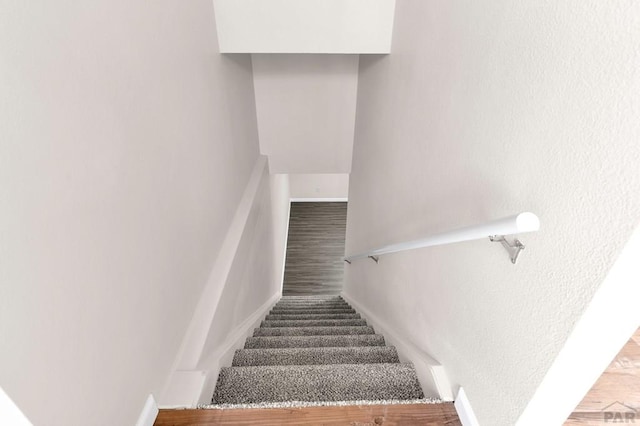 1510 24 1/4 Ln, Pueblo, CO 81006 - stairs featuring baseboards