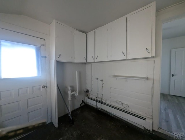 laundry area with a baseboard radiator