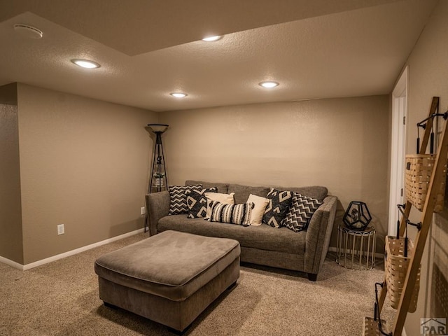 living area with carpet floors, recessed lighting, a textured ceiling, and baseboards